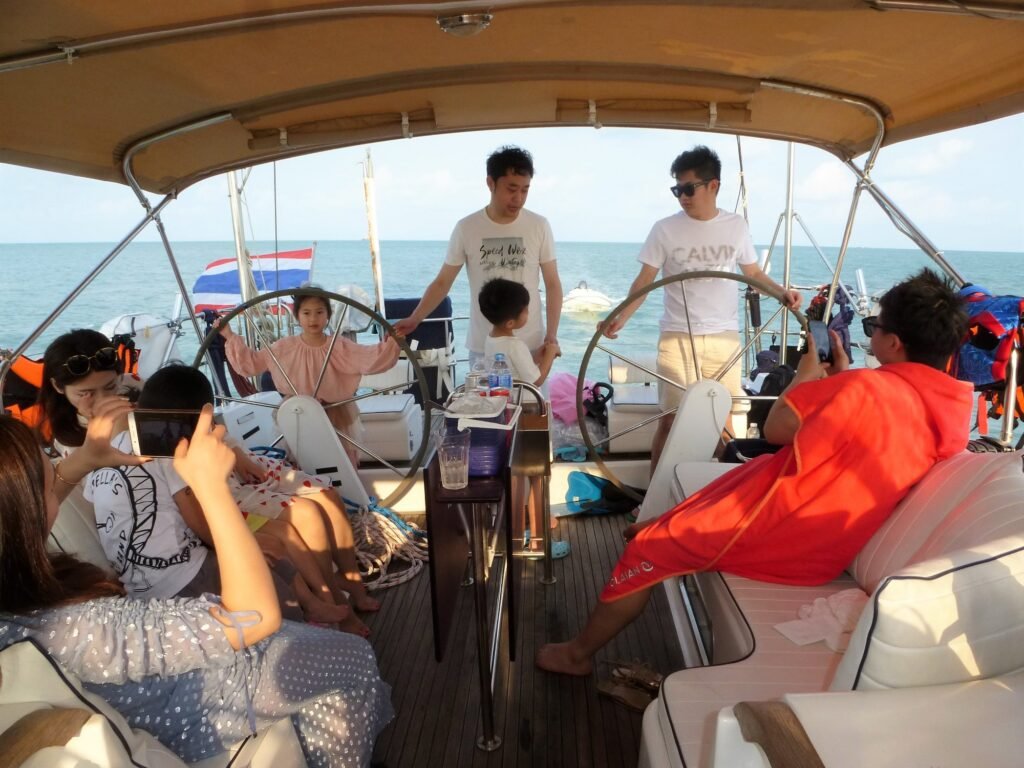 Group of friends on a tour excursion on the luxury sailboat Aello Yachting in Koh Samui, Angthong National marine Park, Koh Phangan, Koh Tan and Koh Madsum, in southern Thailand.