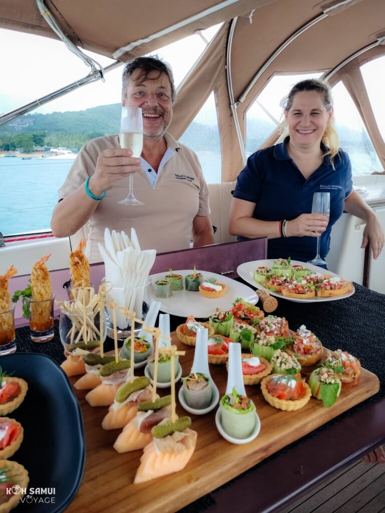 Champagne aperitif with delicacies from the chef aboard the luxury sailboat Aello Yachting in Koh Samui, during a tour of the islands.